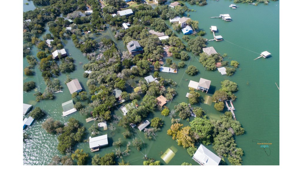 Aerial view of homes damaged by flooding after a hurricane.