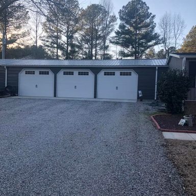 Three 11x8 Wayne Dalton 9100 Sonoma with Stockton glass. 6/12 roof pitch track and Genie jackshaft operators.