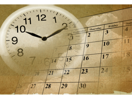 An image of a clock overlaying a calendar, representing punctuality and time management.