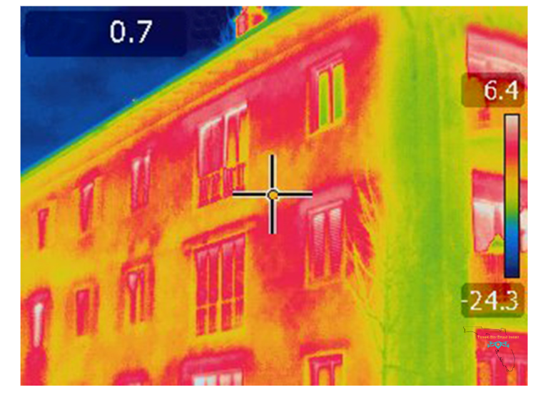 Thermal image of a building showing heat loss and damage detection.